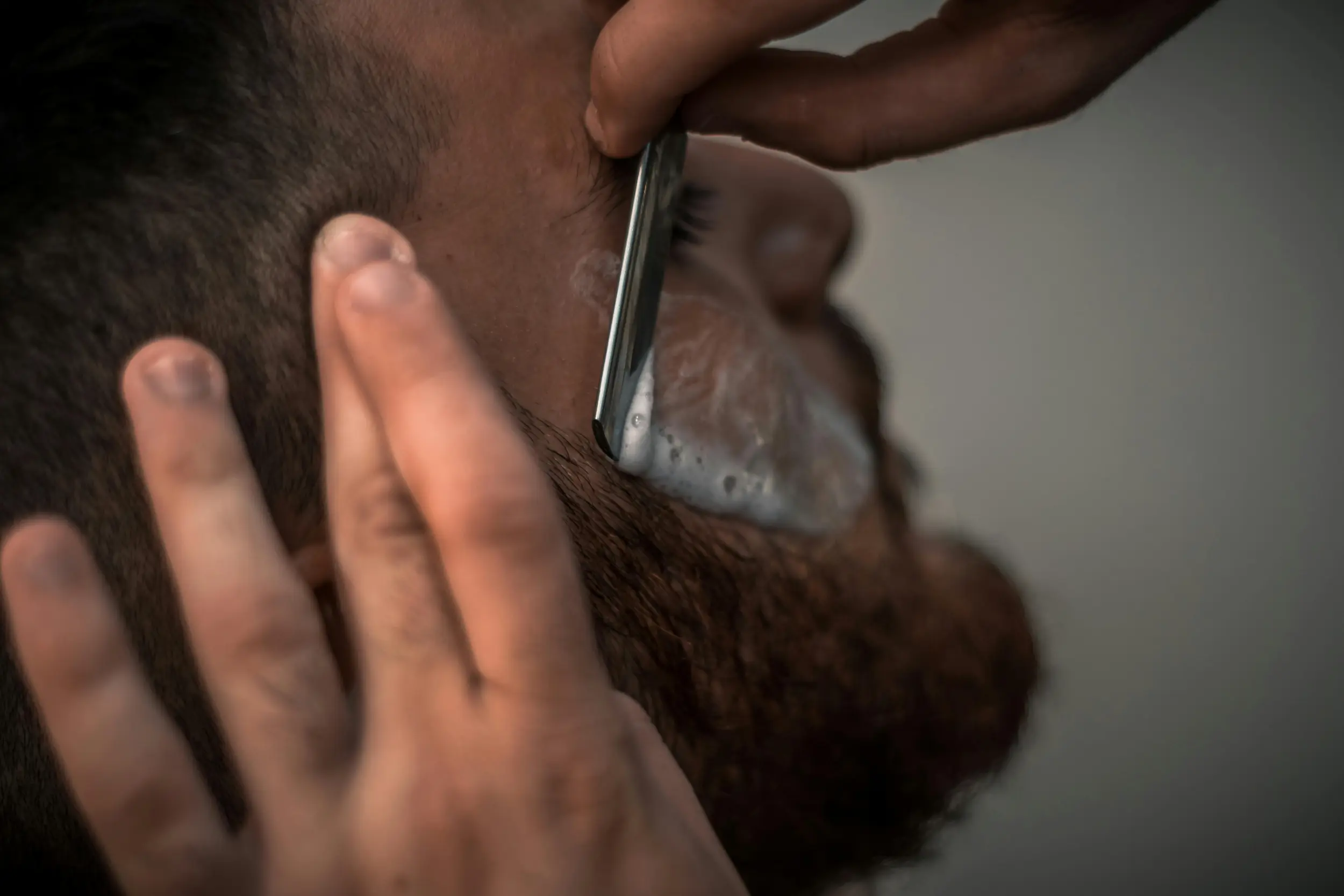 Senior client receiving a haircut at Clipper Craft Barbershop in Edmonton